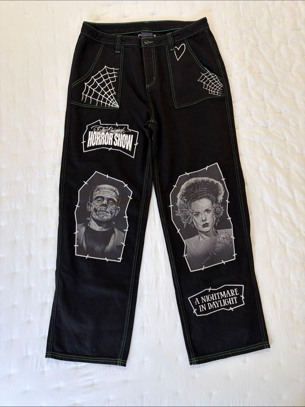 Hot Topic Black Jeans with White Horror Graphics and Green Stitching